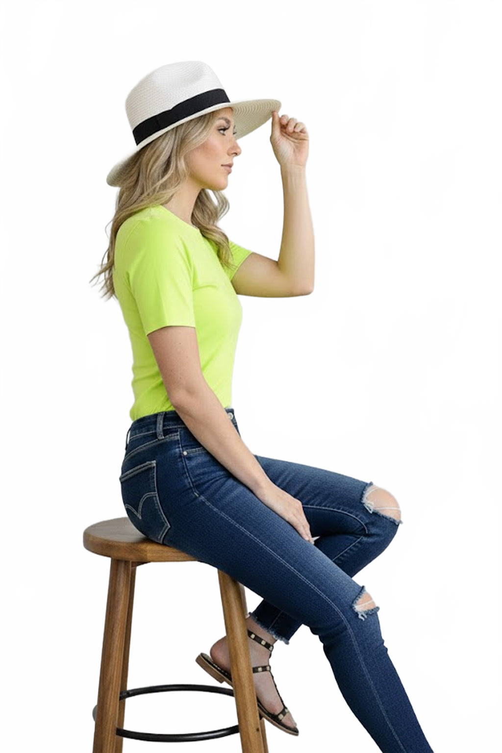 Harlequin Yellow-Green Crewneck Short Sleeve Top Seated Side View with Hat - Flattering Fit Travel Clothing | JudyP Apparel