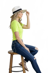 Harlequin Yellow-Green Crewneck Short Sleeve Top Seated Side View with Hat - Flattering Fit Travel Clothing | JudyP Apparel